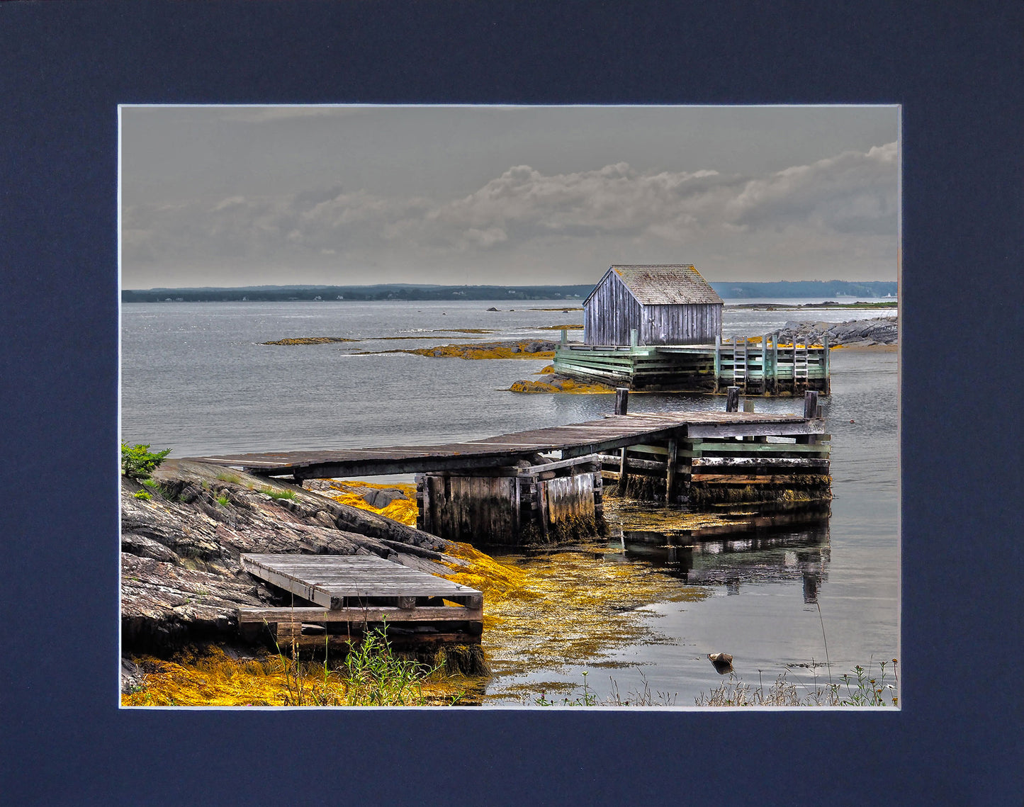 Unique and charming spot in Nova Scotia. Blue Rocks, a cozy little harbor with lots of little fishing shacks.  It's still a working fishing village, with blue slate rocks at the ocean's edge. Print on hight quality paper 8 x 10 inches with a navy blue mat 10 x 13 inches. Place the photography in a frame of your choice and hang it in your favorite decor.