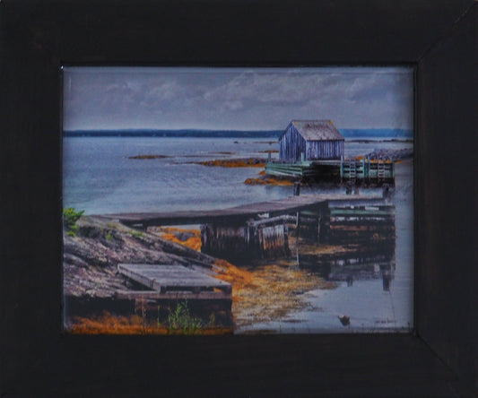 Unique and charming spot in Nova Scotia. Blue Rocks, a cozy little harbor with lots of little fishing shacks. It's still a working fishing village, with blue slate rocks at the ocean's edge. Photography 6 x 8 inches covered with resin in a handmade black wood frame 9 x 11 inches. Ready-to-hang in your favorite room.