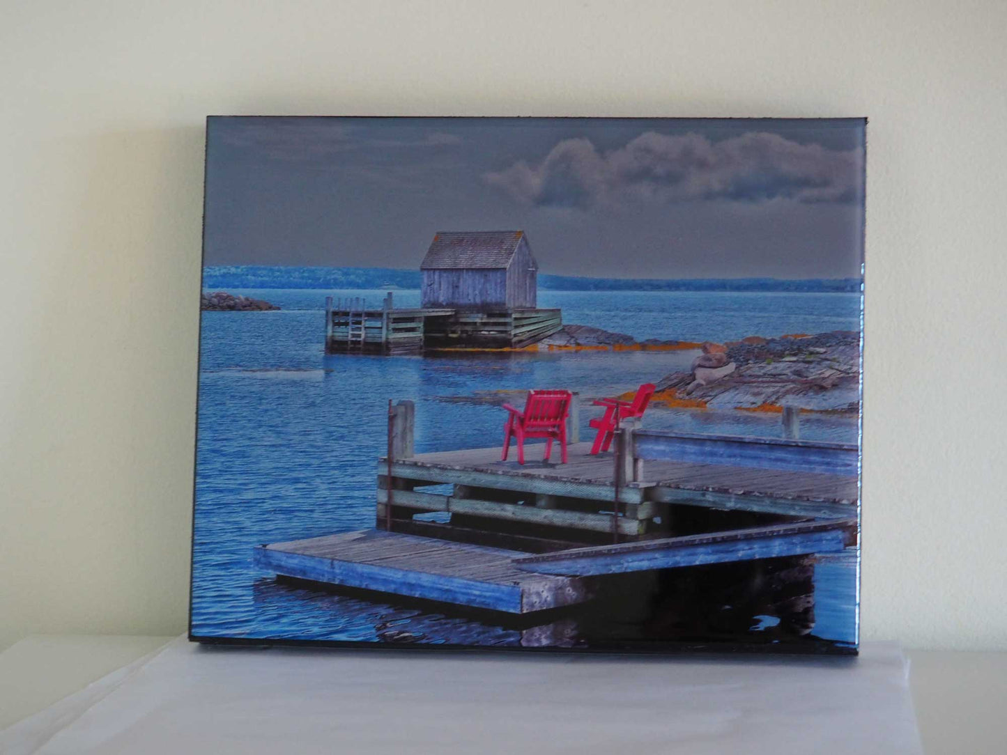 Unique and charming spot in Nova Scotia. Blue Rocks, a cozy little harbor with lots of little fishing shacks. It's still a working fishing village, with blue slate rocks at the ocean's edge. Photography 8 x 10 inches covered with resin. Ready-to-hang in your favorite room.