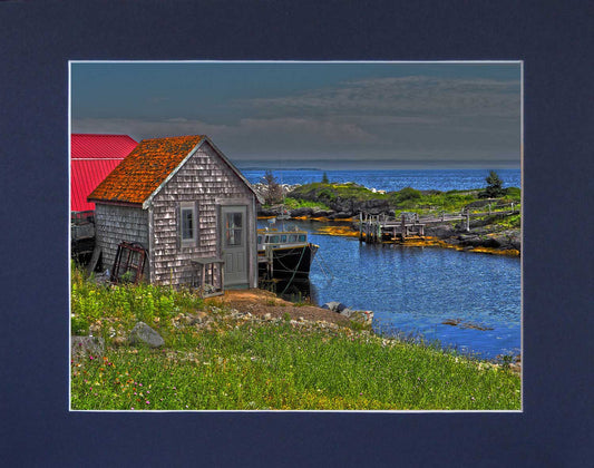 Spectacular view of Blue Rocks harbour featuring a picturesque shingle cabin. Print on hight quality paper 8 x 10 inches with a navy blue mat 10 x 13 inches. Place the photography in a frame of your choice and hang it in your favorite decor.