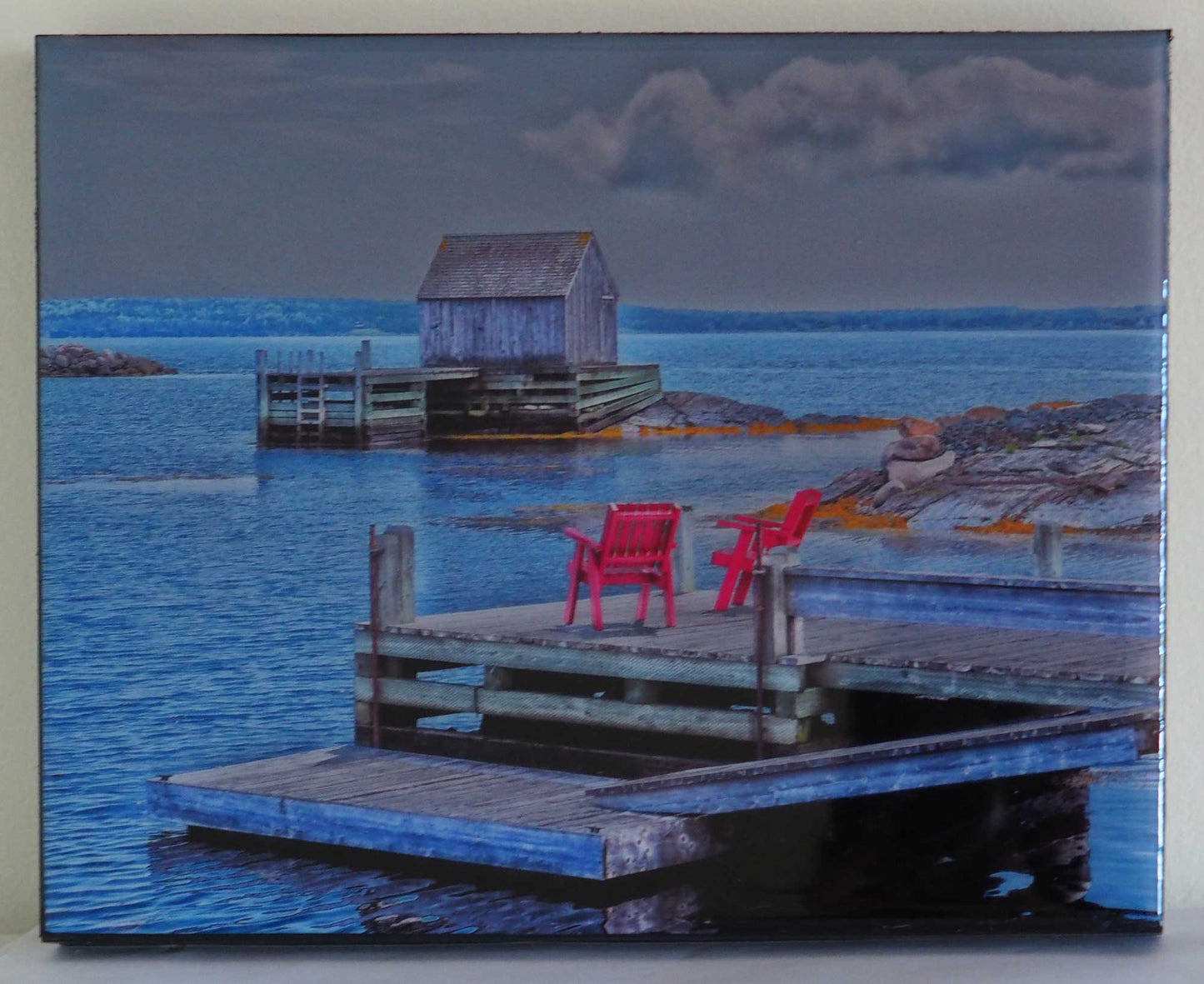 Unique and charming spot in Nova Scotia. Blue Rocks, a cozy little harbor with lots of little fishing shacks. It's still a working fishing village, with blue slate rocks at the ocean's edge. Photography 8 x 10 inches covered with resin. Ready-to-hang in your favorite room.