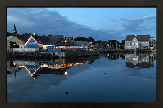 Reflection Pictou Waterfront, on a calm summer night.  10,5 x 16,5 inches photography covered with a thick shinny resin layer on masonite board and a black handmade wooden frame 12 x 18 inches. Ready to hang.