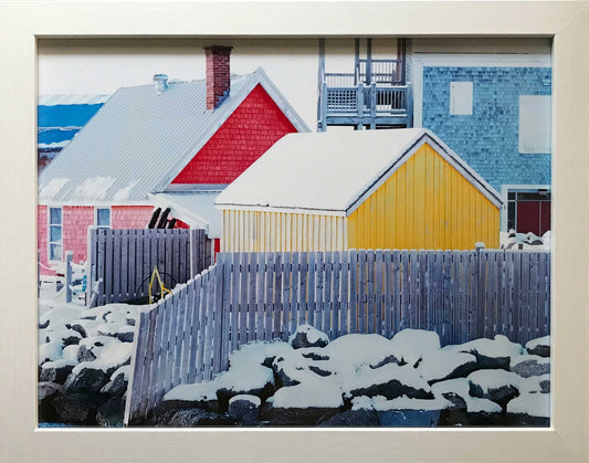 The Ship Hector arrived in Pictou Harbour in Nova Scotia.This photograph captures the splendor of Pictou's Hector Heritage Quay, showcasing its colorful buildings under a blanket of snow. The bright hues of the buildings contrast with the snowy landscape The photo measures 10.5 x 13.75 inches, framed in an elegant white frame measuring 12.75 x 15.75 inches. Ready to hang