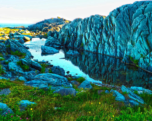 Reflections of the picturesque rock formations at Cape Forchu, near Yarmouth, Nova Scotia. The water and rocks found throughout the region make for very colorful reflections. Resin-coated 8 x 10 inches photo. Now it's up to you to find the perfect wall that will bring out the vibrant colors.