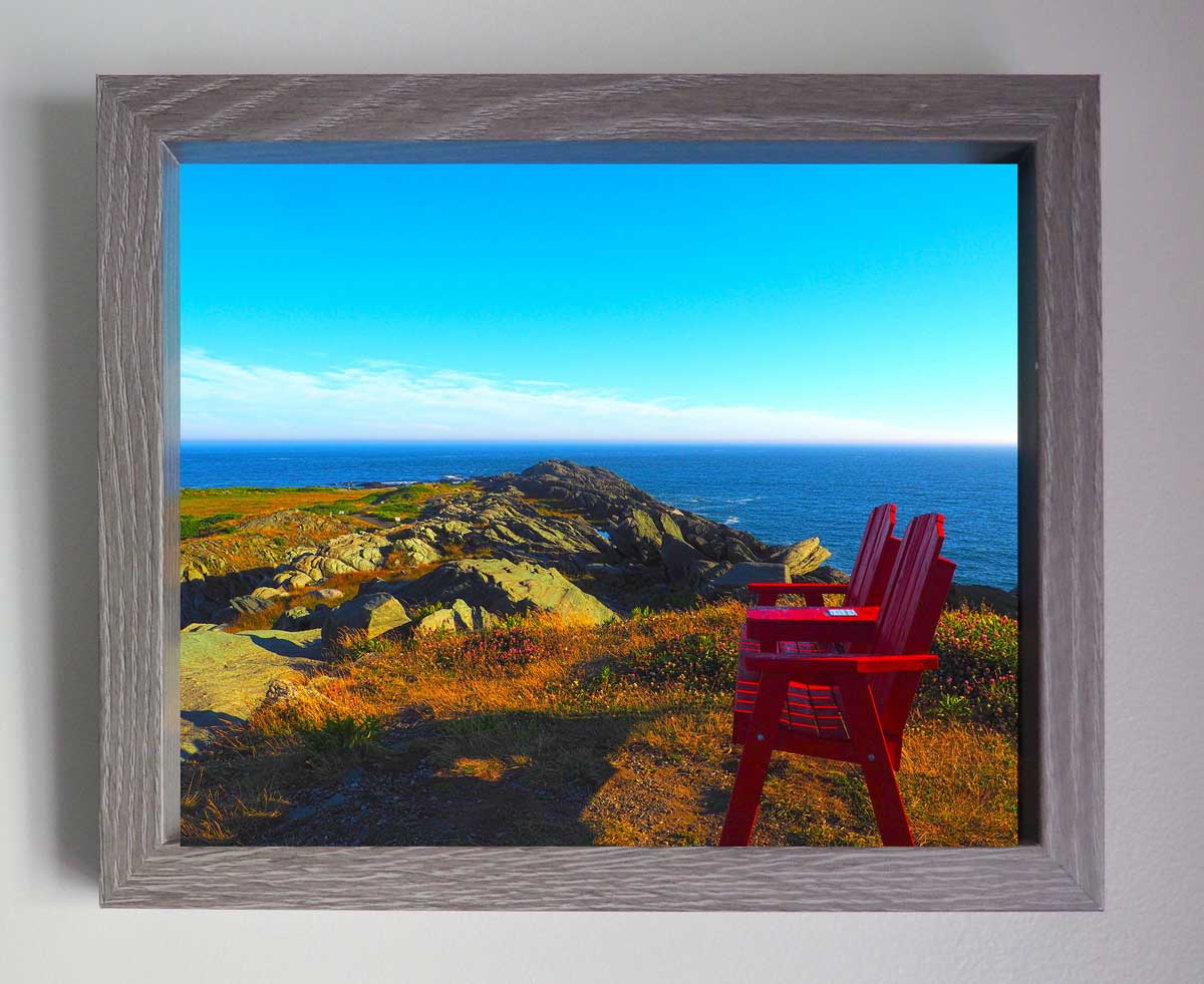 red chairs and admire the sea and the beauty of the landscape... Cape Forchu in Nova Scotia offers splendid sea views. Photograph 7.5 x 9.5 inches in a 9 x 11 inches gray frame protected by glass. Ready to install in your favorite room.