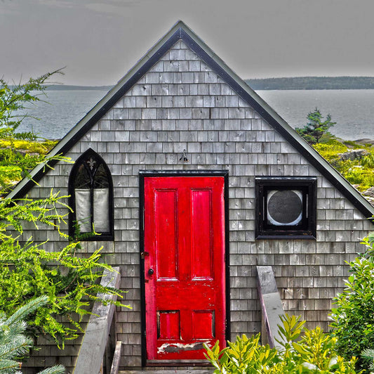 Unique and charming spot in Nova Scotia. Blue Rocks, a cozy little harbor with lots of little fishing shacks. It's still a working fishing village, with blue slate rocks at the ocean's edge. Blue Rocks shingles house with a red door that you can miss. Resin-coated 8 x 8 inches photography. Ready to hang.