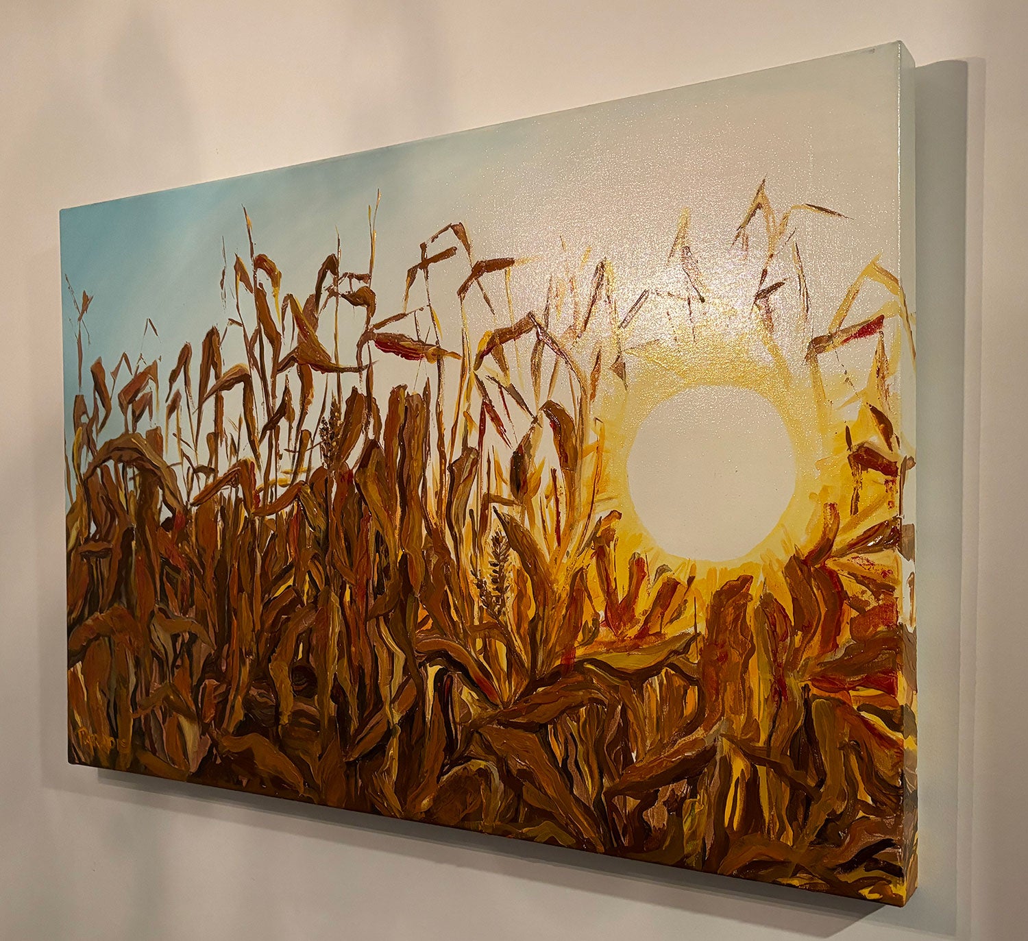 Dry autumn corn stalk field illuminated by the sunlight. high quality giclee print on canvas by a professional canadian urban landscape artist. visual art ready to hang on your wall.