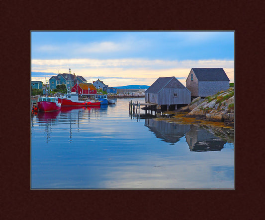 Peggy’s Coveharbour. The mix of modern fishing boats paired with the traditional wooden fishing huts and rocky coastline. Print on hight quality paper 7.75 x 9.75 inches with a burgundy mat 10 x 12 inches.  Place the photography in a frame of your choice and hang it in your favorite decor.